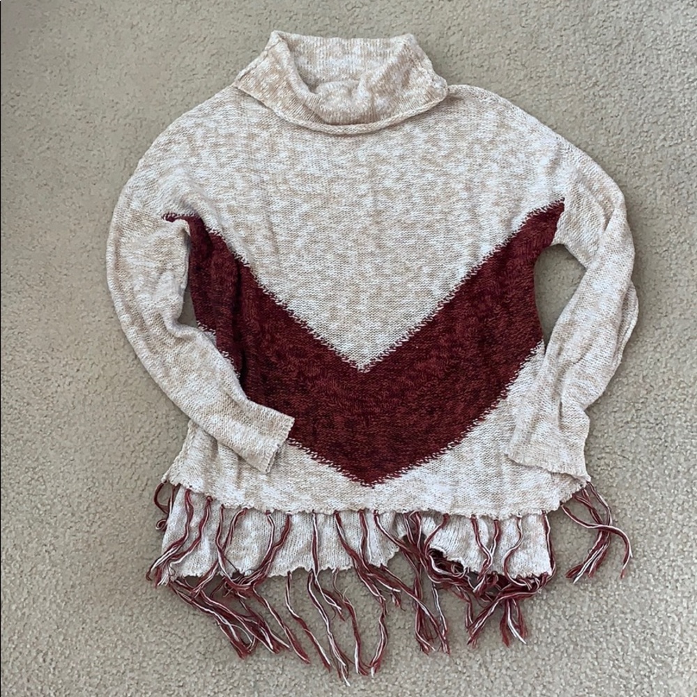 Trendy sweater with detailing on bottom